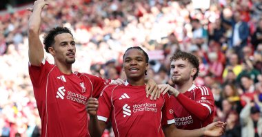 Liverpool&#039;s Rio Ngumoha (C) celebrates scoring the opening goal with Curtis Jones (L) and Harvey Elliott during a pre-season friendly against Athletic Bilbao, Liverpool, U.K., Aug. 4, 2025. (AFP Photo)