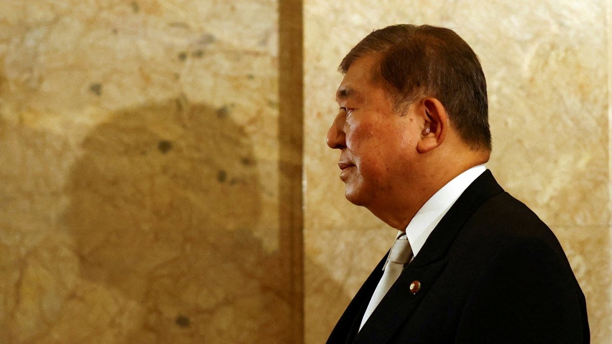 Japan&#039;s Prime Minister Shigeru Ishiba walks toward the upper house hall to attend an opening ceremony of the parliamentary session, Tokyo, Japan, Aug. 1, 2025. (Reuters Photo)