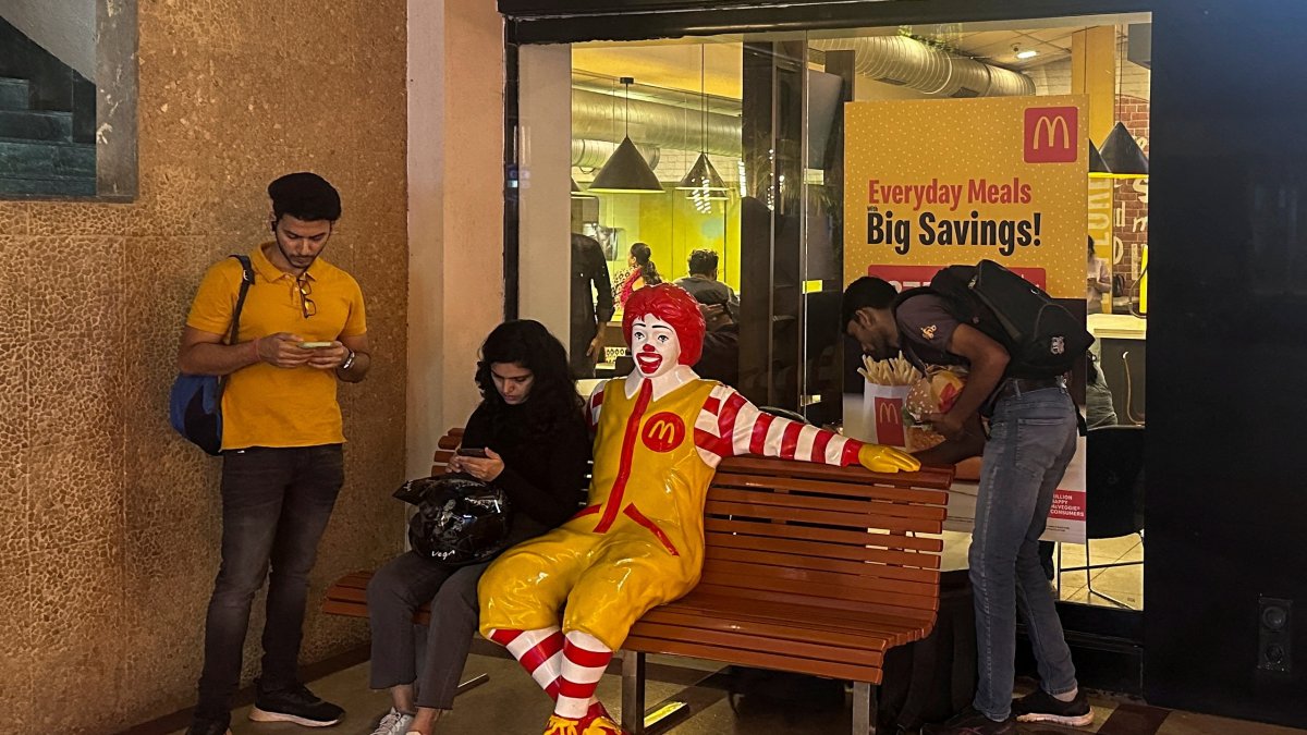 A person sits outside a McDonald&#039;s restaurant in Mumbai, India, Feb. 26, 2024. (Reuters Photo)