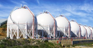 Liquefied natural gas (LNG) tanks are lined up in a row. (Getty Images Photo)