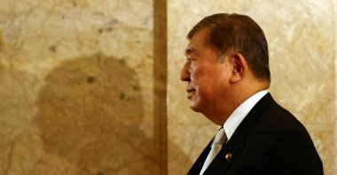 Japan&#039;s Prime Minister Shigeru Ishiba walks toward the upper house hall to attend an opening ceremony of the parliamentary session, Tokyo, Japan, Aug. 1, 2025. (Reuters Photo)