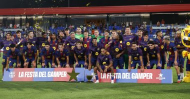 Barcelona players pose with the trophy after the Joan Gamper Trophy match between FC Barcelona and Como 1907 at Johan Cruyff Stadium, Sant Joan Despi, Spain, Aug. 10, 2025. (EPA Photo)