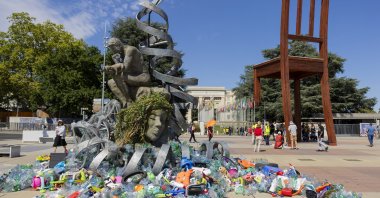 Plastic items are placed next to an artwork by Canadian artist and activist Benjamin Von Wong, titled &quot;The Thinker&#039;s Burden,&quot; European headquarters of the United Nations, Geneva, Switzerland, Aug. 4, 2025. (EPA Photo)