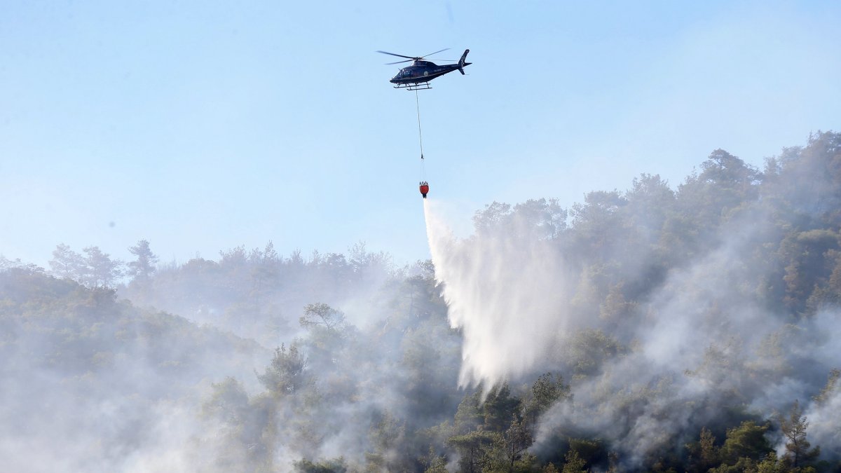 A helicopter extinguishes a fire in Soma, Manisa province, western Türkiye, Aug. 12, 2025. (AA Photo)