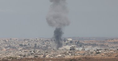 Smoke rises from destroyed buildings following an Israeli airstrike inside Gaza, as seen from the Israeli side, near the border with the Gaza Strip, Aug. 12, 2025. (EPA Photo)