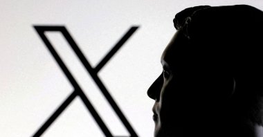 A 3D-printed miniature model of Elon Musk and the X logo are seen in this illustration taken on Jan. 23, 2025. (Reuters Photo)