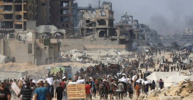 Palestinians carry aid supplies they collected from trucks that entered Gaza through Israel, in Beit Lahia, northern Gaza Strip, Palestine, Aug. 10, 2025. (Reuters Photo)