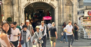 People are photographed exiting the Grand Bazar, Istanbul, Türkiye, July 30, 2025. (IHA Photo)