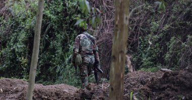 An M23 rebel walks on the outskirts of Matanda, which is controlled by M23 rebels, DRC, March 22, 2025. (Reuters Photo)