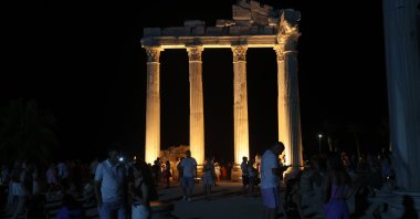 Visitors explore the ancienty city of Side during the nighttime museum experience, Antalya, southern Türkiye, Aug. 5, 2025. (AA Photo)