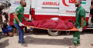 Medics carry casualties of Israeli strikes on members of aid security committees set up by volunteers, Gaza Strip, Palestine, Aug. 13, 2025. (AFP Photo)