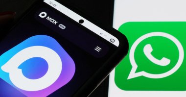 The web page of the Russian MAX messaging app is displayed on a smartphone screen next to the screen displaying the WhatsApp logo, in this illustration taken July 21, 2025. (Reuters Photo)