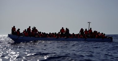 Migrants on a fiberglass boat wait to be assisted by NGO Open Arms rescue boat &quot;Astral” lifeguards in international waters south of Lampedusa, in the Mediterranean Sea, July 24, 2025. (Reuters File Photo)