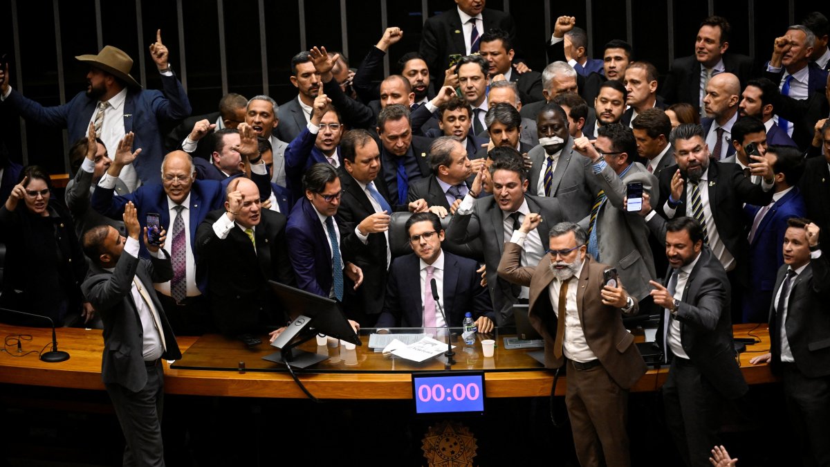 President of the Chamber of Deputies Hugo Motta sits in his chair after the end of a protest by allies of former president Jair Bolsonaro that blocked the resumption of sessions after the mid-year recess in protest against the house arrest of Bolsonaro, at the Chamber of Deputies, Brasilia, Brazil, Aug. 6, 2025. (Reuters Photo)