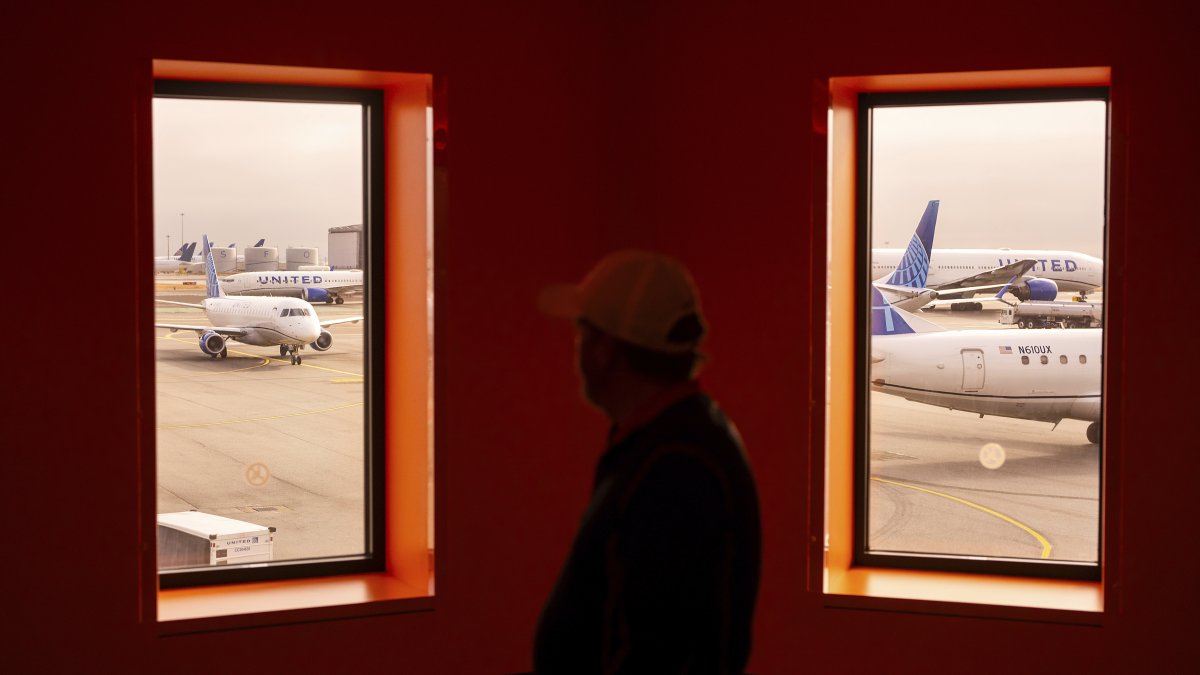 A traveler passes United Airlines planes at San Francisco International Airport, San Francisco, U.S., May 8, 2025. (AP Photo)