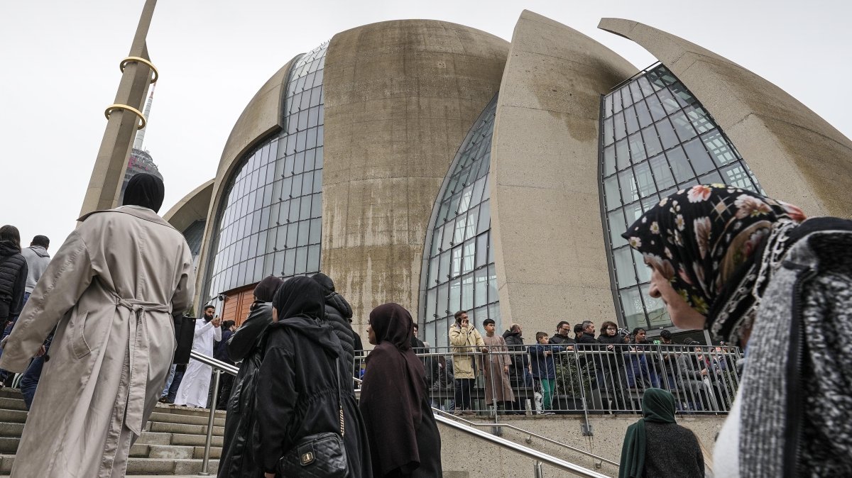 Muslims walk to the Cologne Central Mosque in Cologne, Germany, Friday, Oct. 14, 2022. (AP File Photo)