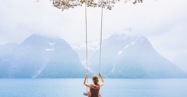 Throughout life, a person swings on an invisible swing, where lightness and heaviness, escape and surrender, freedom and attachment are intertwined. (Shutterstock Photo)