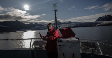 A Turkish scientist checks data during the country’s Arctic expedition, Aug. 11, 2025. (AA Photo)