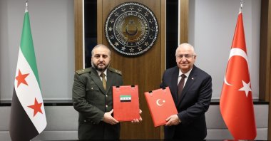 Defense Minister Yaşar Güler (R) and his Syrian counterpart Murhaf Abu Qasra pose after signing a military cooperation agreement at the Defense Ministry, Ankara, Türkiye, Aug.13, 2025 (IHA Photo)