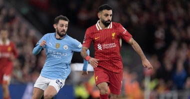 Liverpool&#039;s Mohamed Salah (R) and Manchester City&#039;s Bernardo Silva in action during the Premier League match at Anfield, Liverpool, U.K., Dec. 1, 2024. (Getty Images Photo)