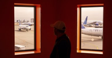 A traveler passes United Airlines planes at San Francisco International Airport, San Francisco, U.S., May 8, 2025. (AP Photo)