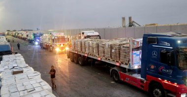 Trucks carrying humanitarian aid line up near the Rafah border crossing between Egypt and the Gaza Strip, Rafah, Egypt, Aug. 13, 2025. (Reuters Photo)