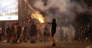 A person fires fireworks during anti-government protests in Belgrade, Serbia, Aug. 14, 2025. (Reuters Photo)