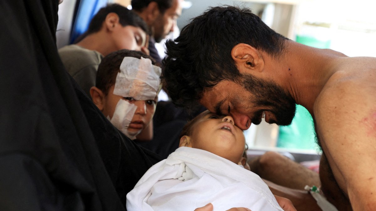 A Palestinian man mourns the death of his son, Kanan Bakr, killed in an early morning Israeli strike on a tent, according to medics, Gaza City, Palestine, Aug. 15, 2025. (Reuters Photo)