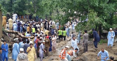 Volunteers and rescue officials search the rubble after a cloudburst, Bajaur, Pakistan, Aug. 15, 2025. (EPA Photo)