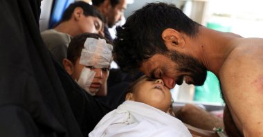 A Palestinian man mourns the death of his son, Kanan Bakr, killed in an early morning Israeli strike on a tent, according to medics, Gaza City, Palestine, Aug. 15, 2025. (Reuters Photo)