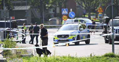 Police on scene outside a mosque after a shooting in Orebro, Sweden, Friday, Aug. 15, 2025. (Fredrik Sandberg/TT via AP)