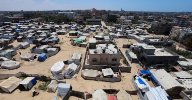 Palestinians, displaced by Israeli attacks, shelter in a tent camp in Deir al-Balah in the central Gaza Strip, Aug. 5, 2025. (Reuters Photo)