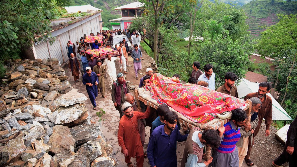 Mourners carry the coffins of flood affected victims after flash floods in Naryean Behaak village some 36 kilometers north from Muzaffarabad, the capital of Pakistan-administered Kashmir on Aug. 15, 2025. (AFP Photo)