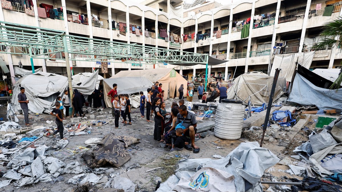 Palestinians inspect the site of a Friday Israeli strike on a school that was sheltering displaced people, in Gaza City, Aug. 16, 2025. (Reuters Photo)