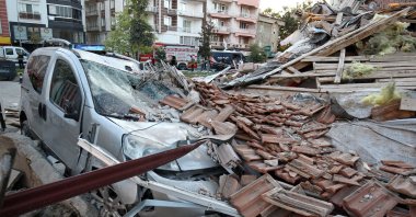 A damaged vehicle lies under the rubble of a collapsed building after an earthquake in Sındırgı in the western Balıkesir province, Türkiye, Aug. 11, 2025. (Reuters Photo)