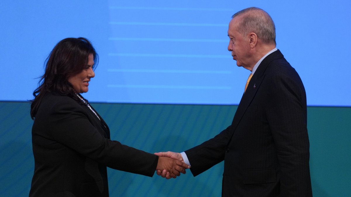 Aydın Mayor Özlem Çerçioğlu (L) shakes hands with President Recep Tayyip Erdoğan at an event, Ankara, Türkiye, Aug. 14, 2025. (AA Photo)
