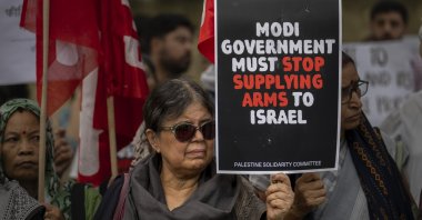 A woman holds a placard denouncing the genocide in Gaza and to show solidarity with the people of Palestine during a protest, New Delhi, India, June 1, 2024. (AP Photo)