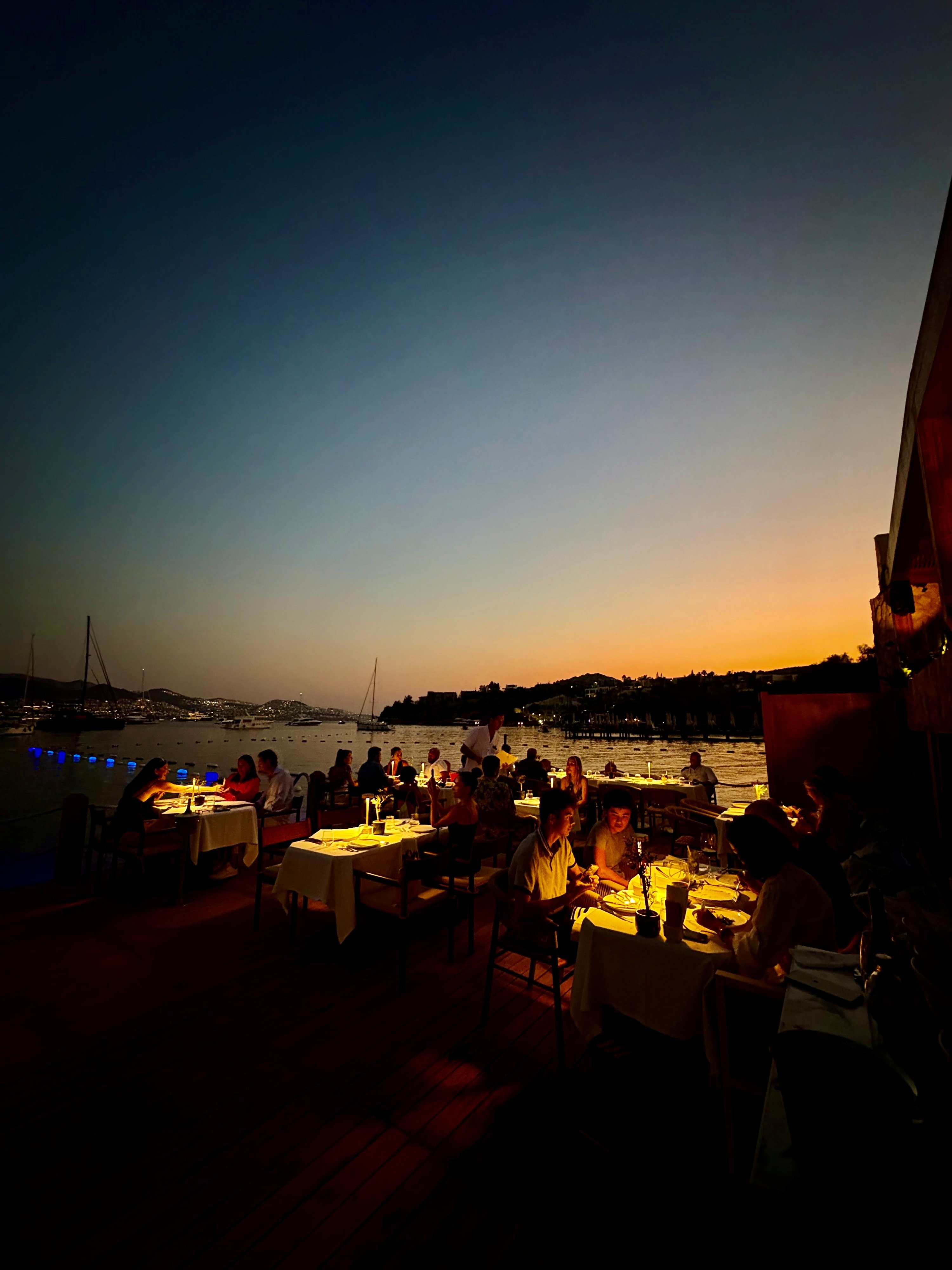 Guests enjoy dinner at sunset at Hodan, Bodrum, Muğla, Türkiye, Aug. 13, 2025. (Photo by Funda Karayel)
