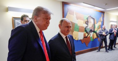 U.S. President Donald Trump and Russian President Vladimir Putin walk to a joint news conference following their meeting in Anchorage, Alaska, U.S., Aug. 15, 2025. (Reuters Photo)