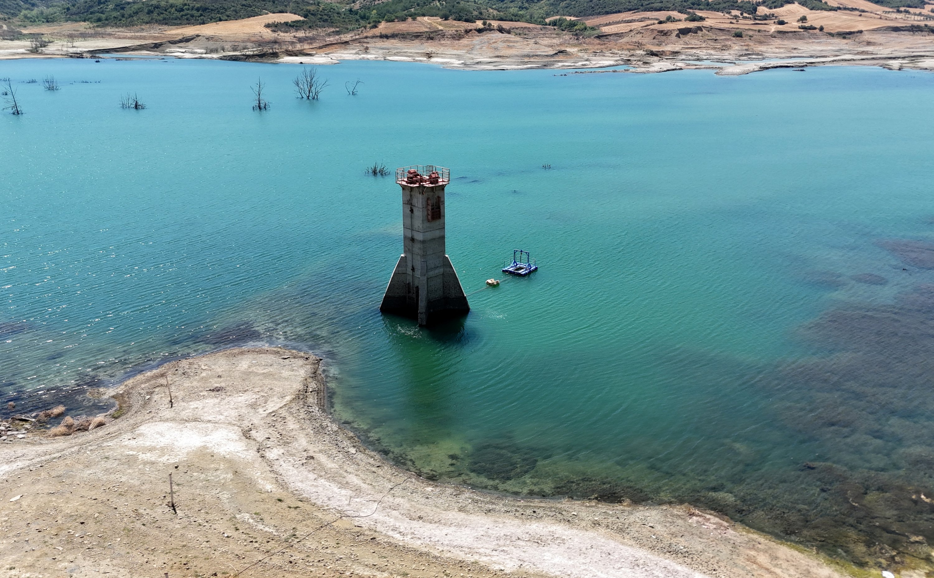 A drone view shows low water levels and exposed terrain at Naip Dam, as drought conditions continue to affect water levels, in Süleymanpaşa, northwestern Tekirdağ province, Türkiye, Aug. 11, 2025. (Reuters Photo)