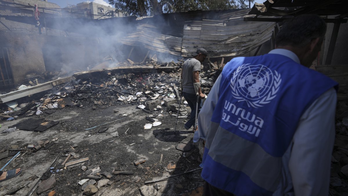 Palestinians look at the destruction after an Israeli strike on a school run by UNRWA, in Nuseirat, Gaza Strip, Palestine, May 14, 2024. (AP Photo)