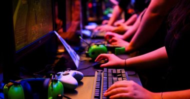 Visitors play a game during the 2024 Gamescom computer and video game industry event, Cologne, Germany, Aug. 21, 2024. (Reuters Photo)