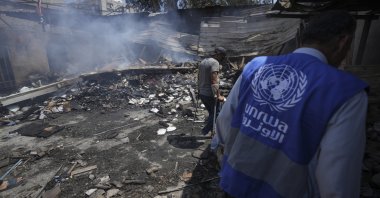Palestinians look at the destruction after an Israeli strike on a school run by UNRWA, in Nuseirat, Gaza Strip, Palestine, May 14, 2024. (AP Photo)
