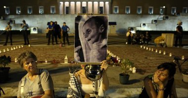 Protestors hold pictures of starving Gaza children during a pro-Palestinian rally in Athens, Greece, July 24, 2025. (EPA Photo)