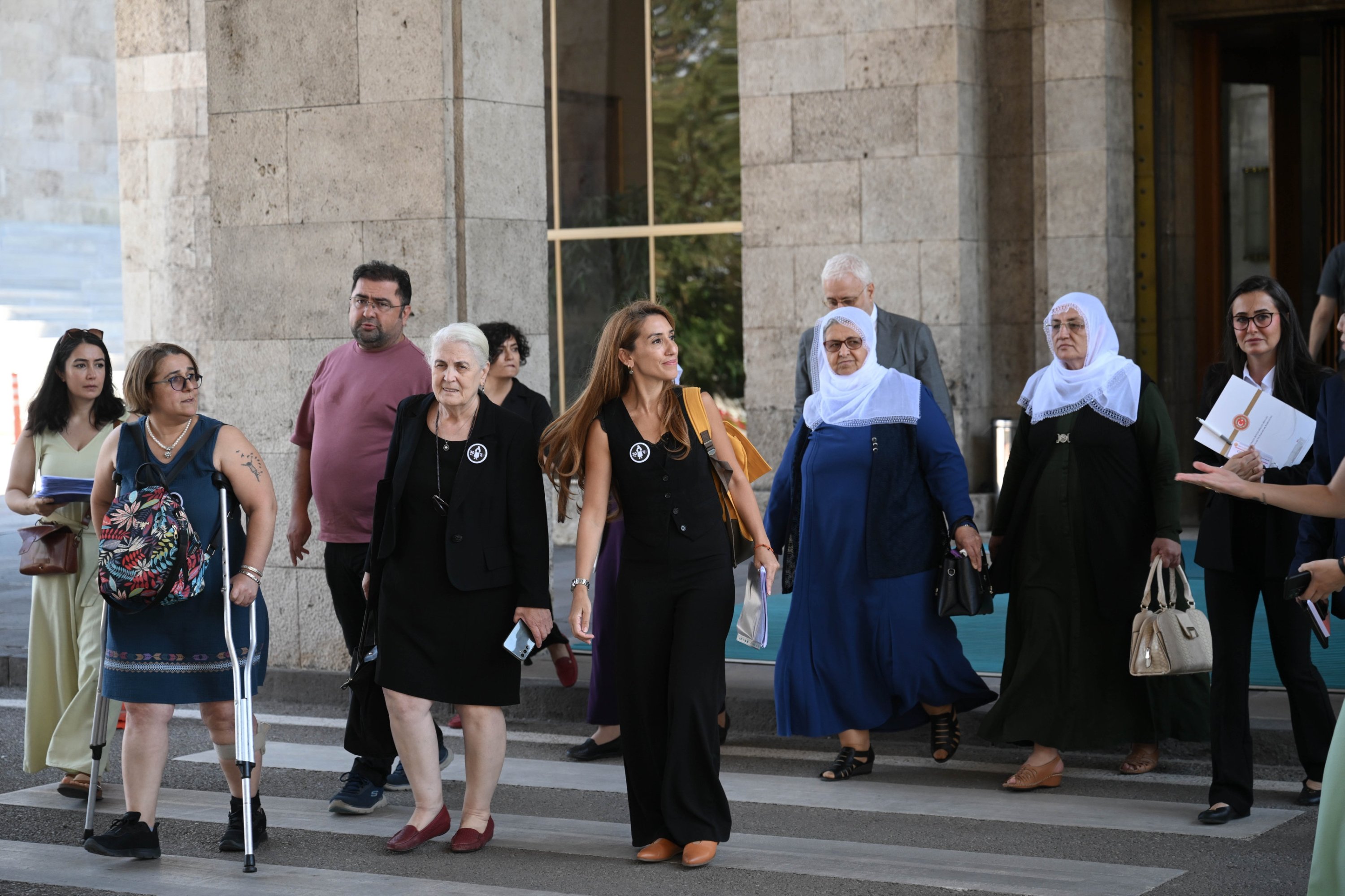 Groups representing the "Saturday Mothers" and the "Peace Mothers" arrive for the parliamentary committee's session, Ankara, Türkiye, Aug. 20, 2025. (AA Photo)