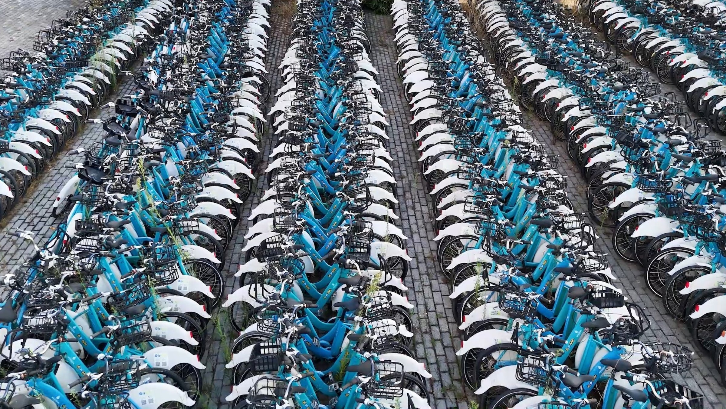 An aerial view shows thousands of ISbike bicycles stored in vacant lots as stations deteriorate across the city, Istanbul, Türkiye, Aug. 20, 2025. (IHA Photo)