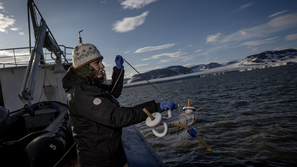 Ph.D. student Bilge Durgut from the METU Institute of Marine Sciences conducts Arctic research on seawater, sediment, sea ice and glacier samples aboard the expedition boat, July 24, 2025. (AA Photo)