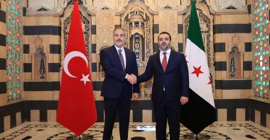 A handout picture released by the official Syrian Arab News Agency shows Syrian Foreign Minister Asaad al-Shibani (R) welcoming his Turkish counterpart Hakan Fidan, Damascus, Syria, Aug. 7, 2025. (AFP Photo)