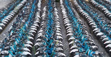 An aerial view shows thousands of ISbike bicycles stored in vacant lots as stations deteriorate across the city, Istanbul, Türkiye, Aug. 20, 2025. (IHA Photo)
