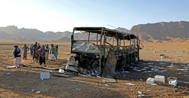 Onlookers stand at the site of a bus crash in Guzara district of Herat province, Afghanistan, Aug. 20, 2025. (AFP Photo)
